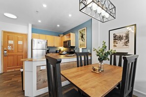 Enjoy cooking in this well-equipped kitchen with a refrigerator, microwave, and dining area.