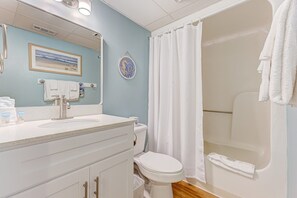 A bathroom with a sink, toilet, and shower. - 0207 Dancing Tides 1 Bedroom Condo (Carolina Beach)
