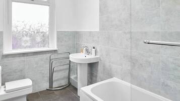 Shower, hair dryer, towels, shampoo
