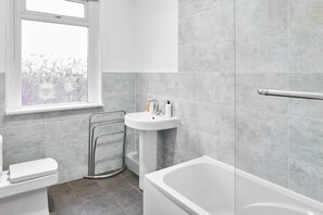 Shower, hair dryer, towels, shampoo