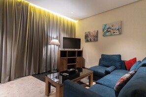 Superior Suite, 1 Double Bed, Kitchenette | Living area | TV