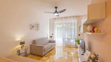 Apartment, Patio | Living area | 35-inch TV with digital channels