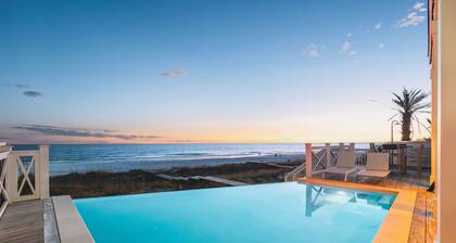 Gulf-front luxury with infinity pool, direct beach access, game room, & elevator