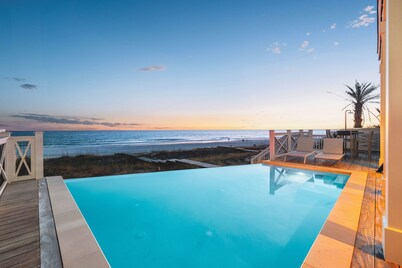 Gulf-front luxury with infinity pool, direct beach access, game room, & elevator