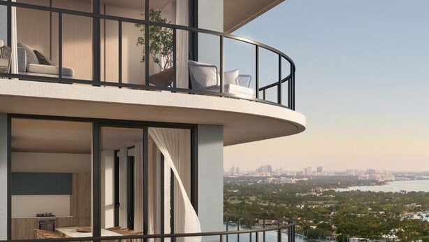A multi-level residential building with balconies overlooking a body of water. - 580 Residance (Miami Beach)