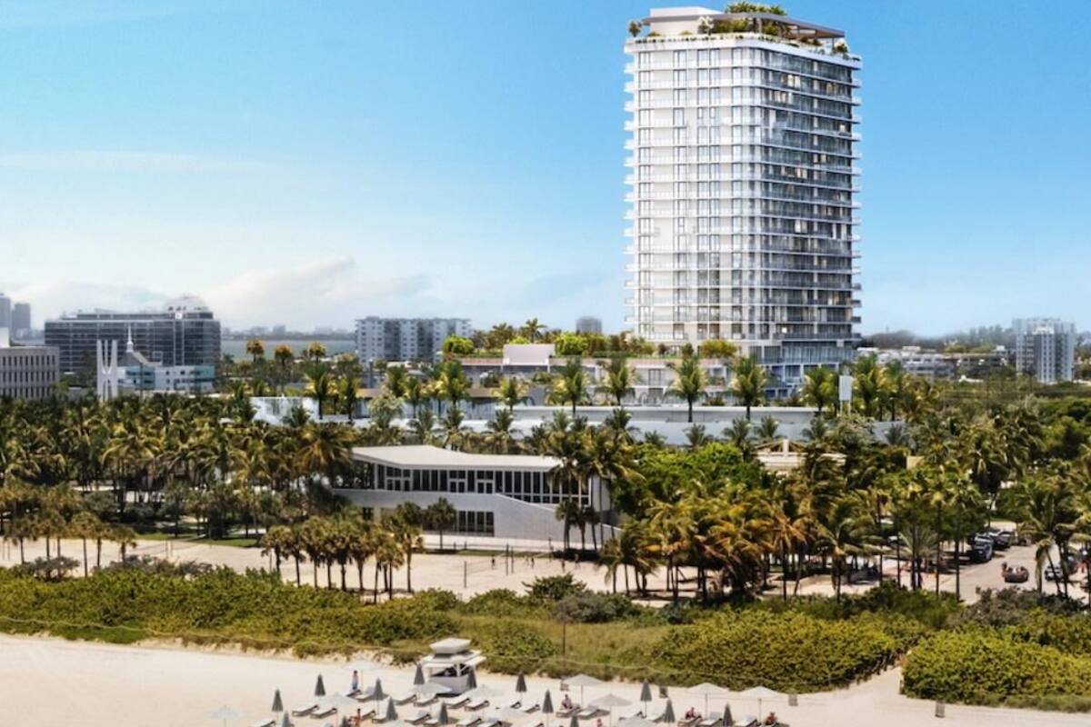 A high-rise hotel with a curved facade, a rooftop garden, and a beachfront location with palm trees and beach umbrellas.