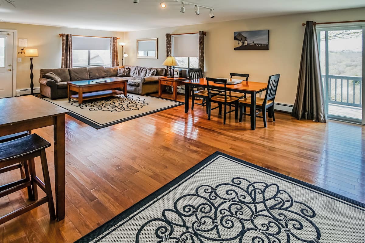 Deluxe Condo, 2 Bedrooms, Kitchen | Living area | 40-inch TV with satellite channels