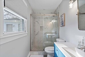 Shower, hair dryer, towels