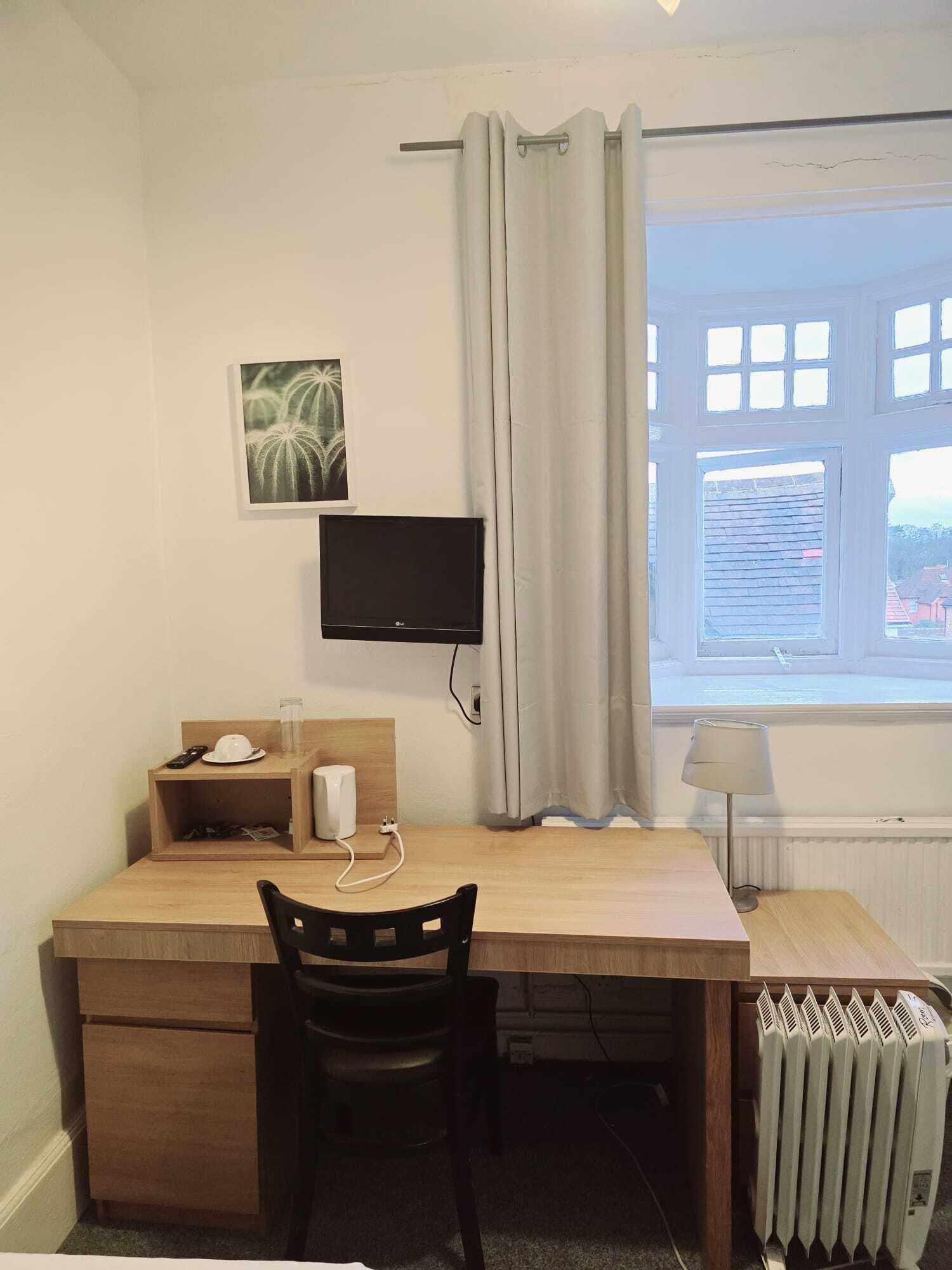 Desk, laptop workspace, free WiFi, bed sheets