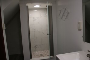 Shower, hair dryer, towels, soap