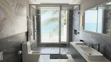 Junior Suite, Beach View | Bathroom | Shower, hair dryer, bathrobes, towels