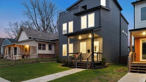 A modern two-story house with a covered porch and a staircase leading to the entrance. - The Linden Home - Fountain Square Indianapolis (Indianapolis)