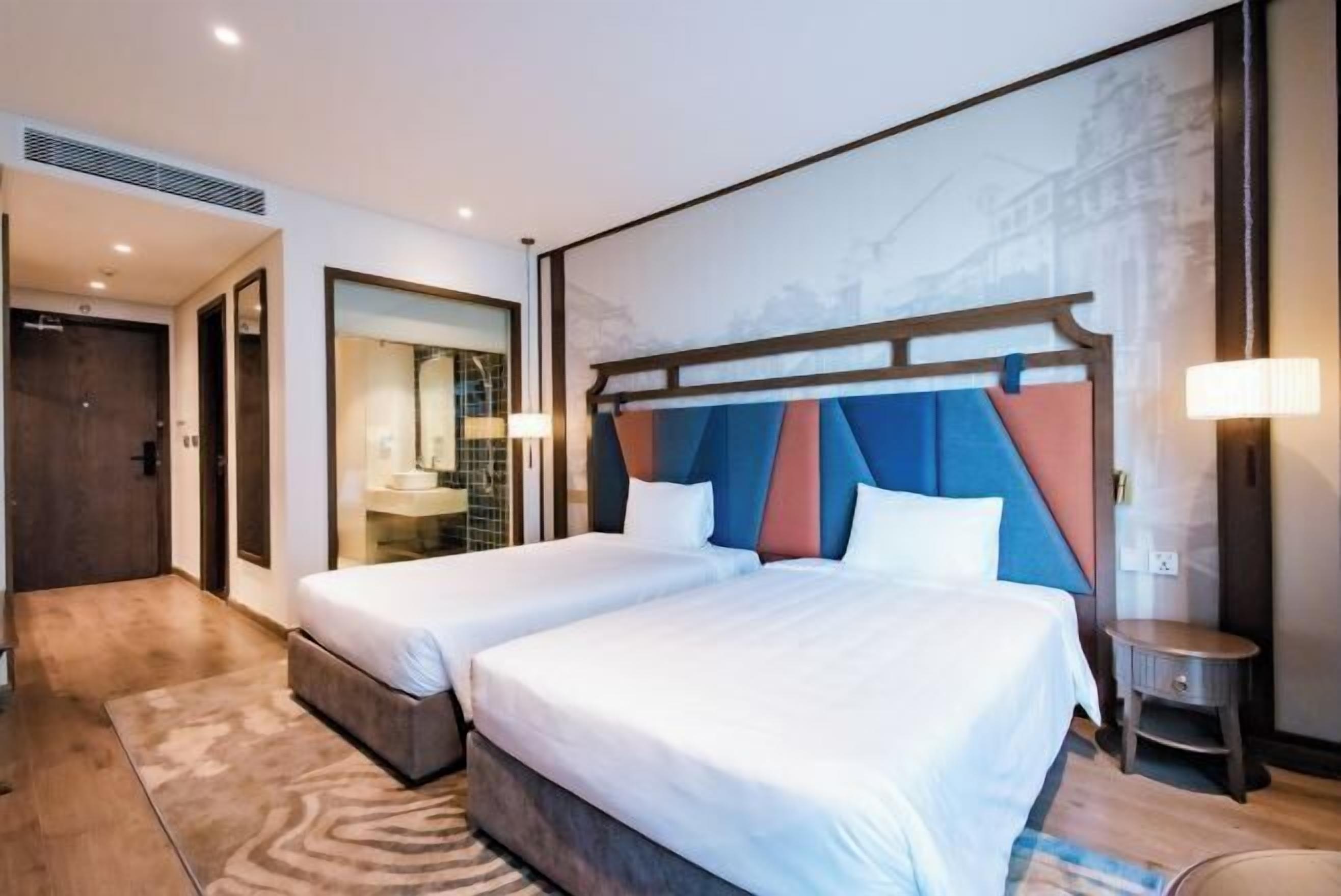 Premium bedding, down comforters, Tempur-Pedic beds, free minibar