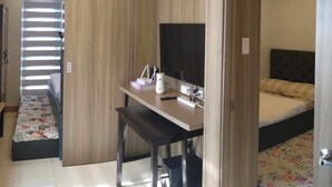 Comfort Condo, Balcony, Sea View | Living area | 42-inch Smart TV with digital channels, Netflix, streaming services - Condo next door (Pasay)