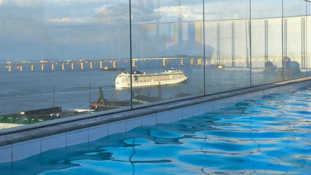 A pool with a view of a cruise ship and a bridge in the background. - Skylux Studio Museum of Tomorrow, Rio de Janeiro Wonderful and Safe.  (Centro Rio de Janeiro)