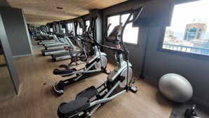 A gym with multiple treadmills, exercise bikes, and a large exercise ball. - Skylux Studio Museum of Tomorrow, Rio de Janeiro Wonderful and Safe.  (Centro Rio de Janeiro)