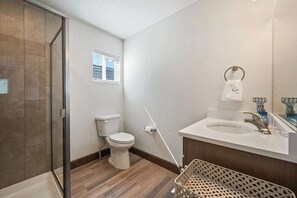 Shower, hair dryer, towels, shampoo