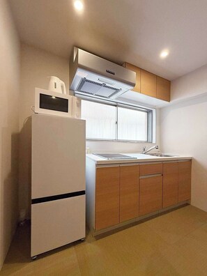 Fridge, microwave, cookware/dishes/utensils