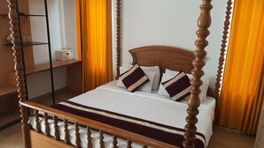 A four-poster bed with a wooden headboard, white bedding, and striped pillows. - KOSHA RESORT (Meerut)