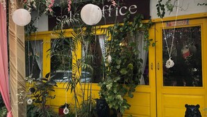 A yellow building with a sign reading "office" and a large glass door. - KOSHA RESORT (Meerut)