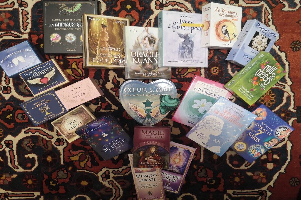 A collection of books on a patterned carpet.