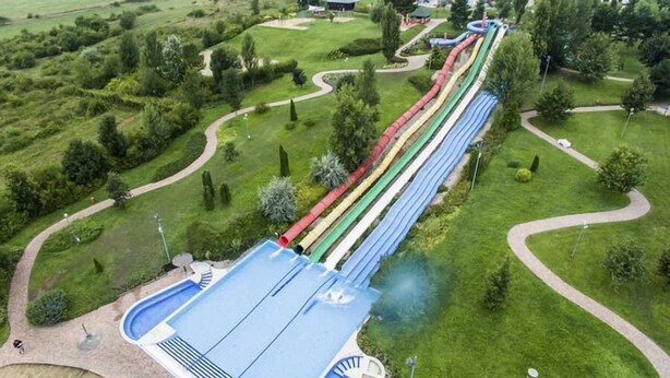 A water park with multiple slides and a pool area. - Olive Garden Hotel Baku (Baku)