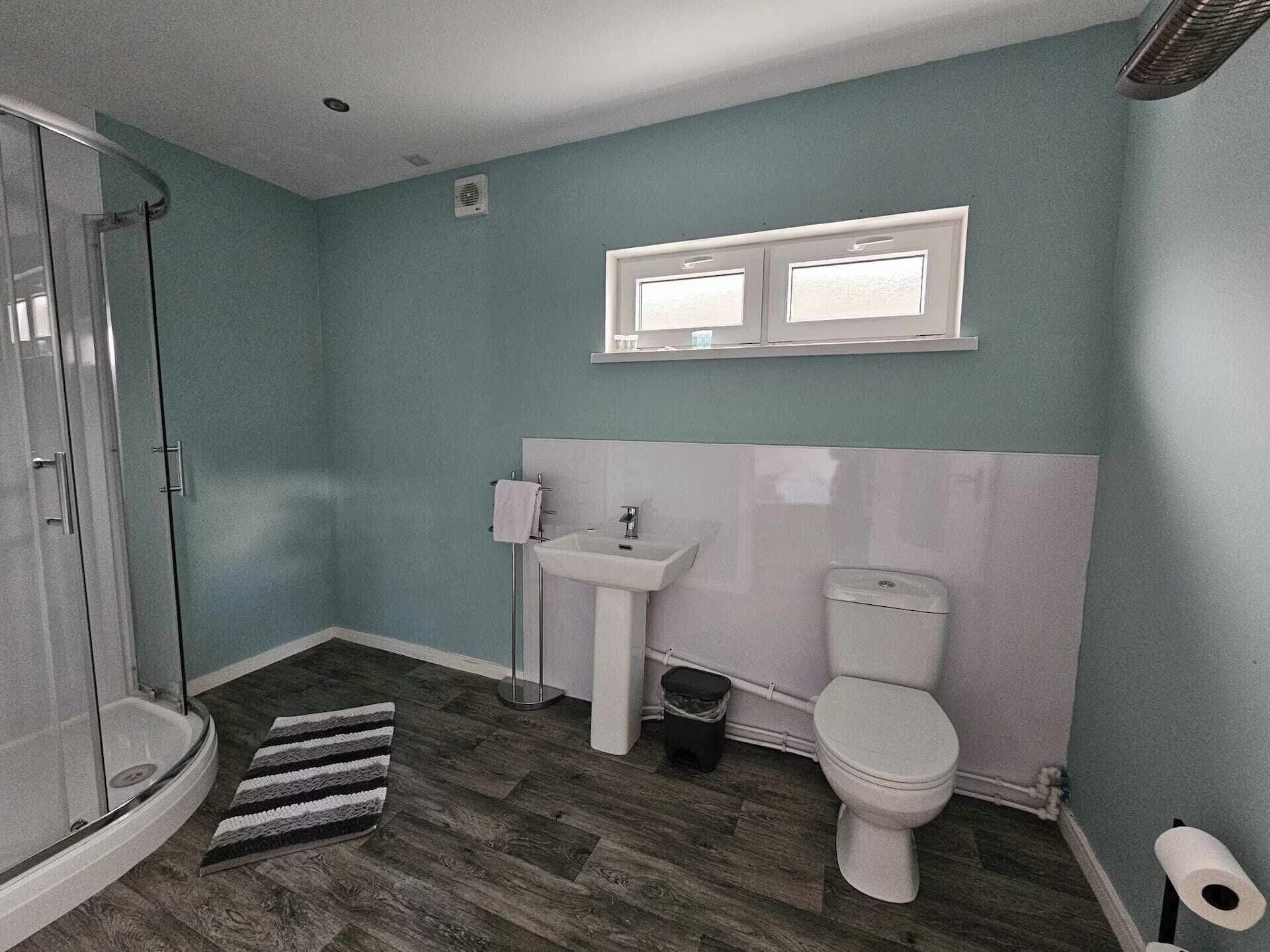 Shower, hair dryer, towels, toilet paper