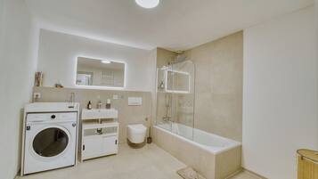 Hair dryer, slippers, towels, soap