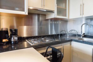 Fridge, microwave, stovetop, coffee/tea maker