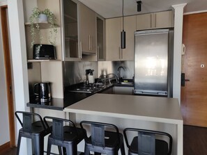 Fridge, microwave, stovetop, coffee/tea maker