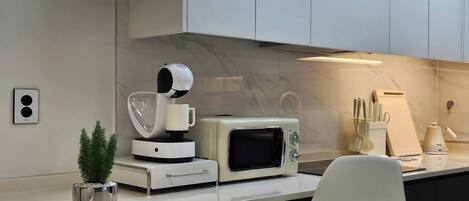 Fridge, microwave, cookware/dishes/utensils