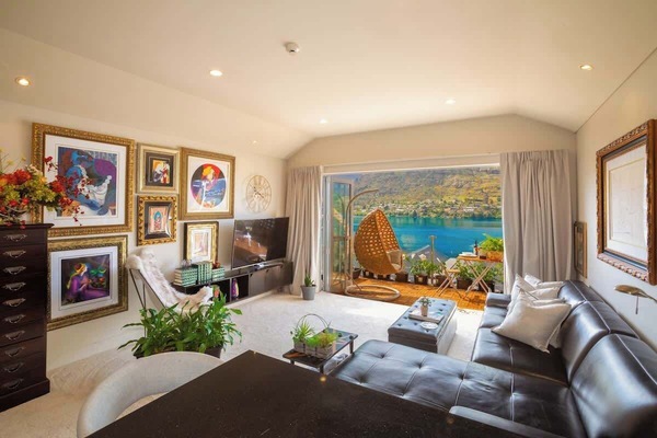Large living area, with doors opening onto the decking area for lots of natural light and ventilation. Stunning views of the lake and mountain ranges.