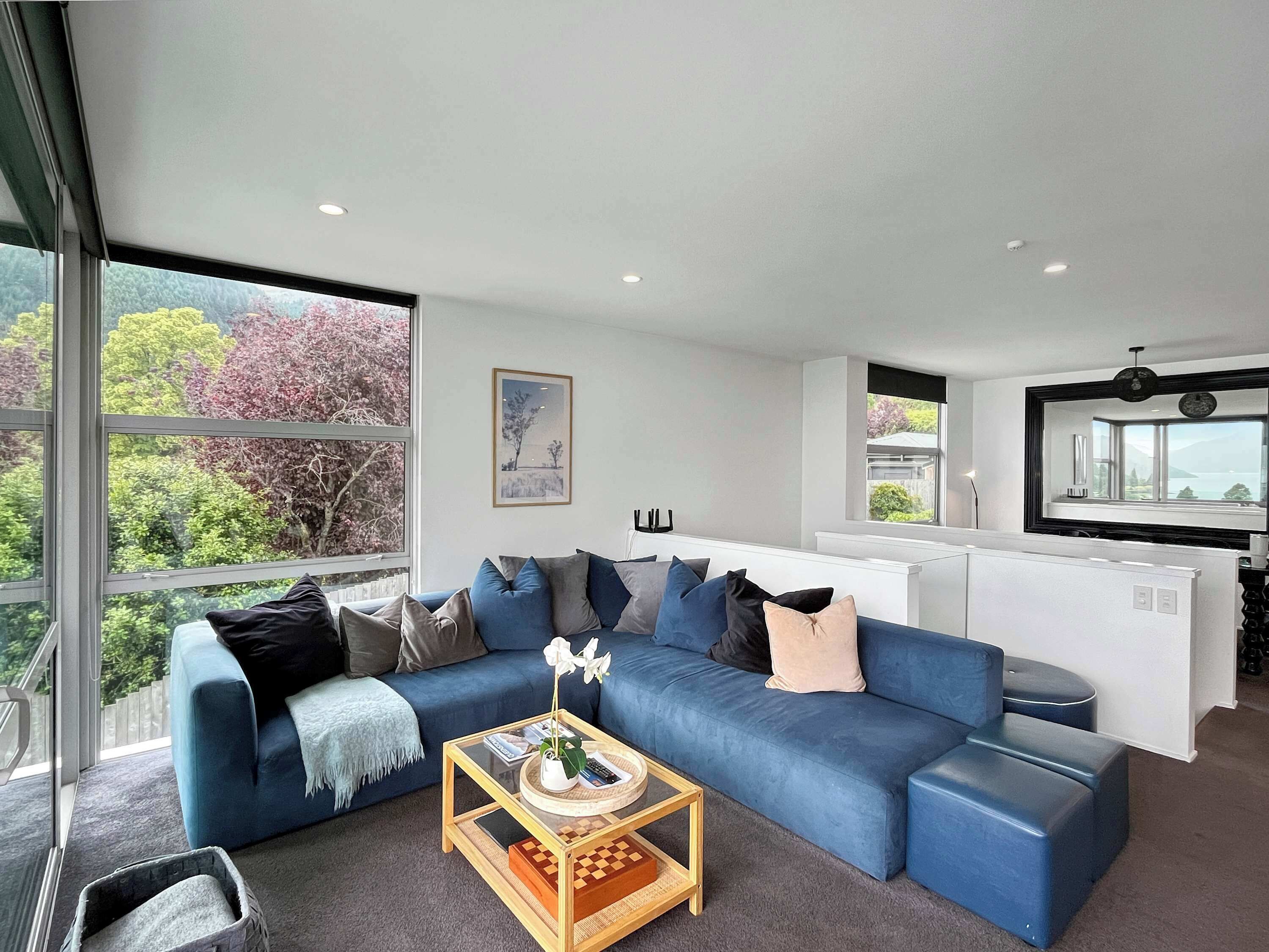 Light-filled lounge with large windows and cozy seating