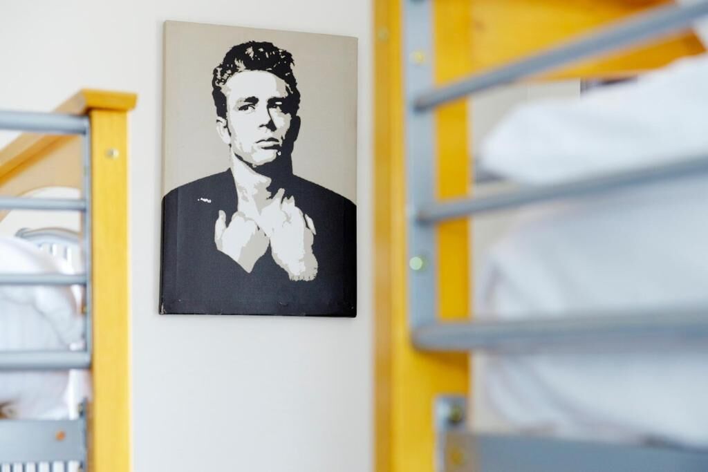 A photograph of a person in a suit hanging on a wall.