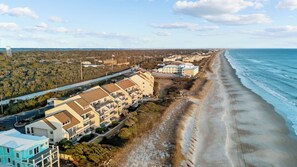 A coastal hotel with multiple buildings, a beach, and a road. - Pi in the Sky - Oceanfront, top floor, glorious views! Beachwalk 314 (Pine Knoll Shores)