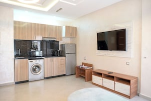 Junior Apartment, Balcony, City View | Private kitchen | Full-size fridge, microwave, stovetop