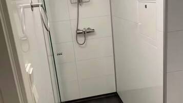 Shower, towels, soap, toilet paper