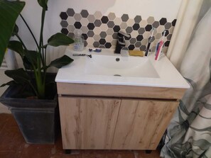 Shower, hair dryer, towels, toilet paper