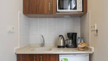 Mini-fridge, microwave, stovetop