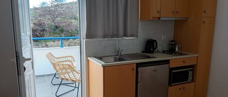 Microwave, stovetop, coffee/tea maker, electric kettle