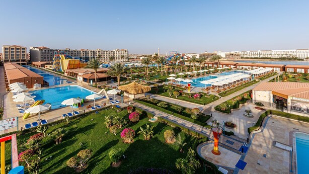 A resort with multiple swimming pools, sun loungers, and a well-maintained garden. - SUNRISE Solara Aqua park Resort (Hurghada)