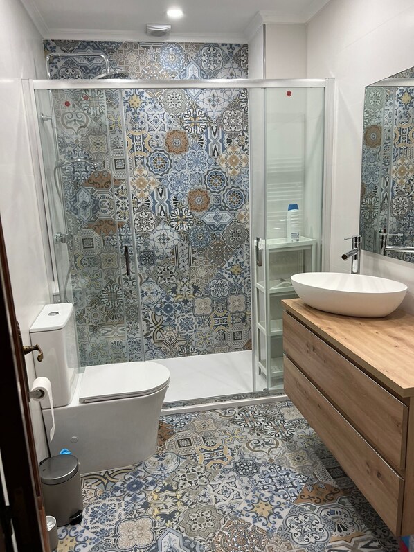 Shower, hair dryer, towels, soap
