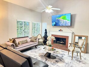 Smart TV, fireplace, books