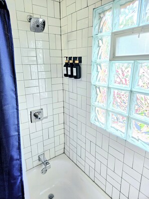 Shower, hair dryer, towels, soap