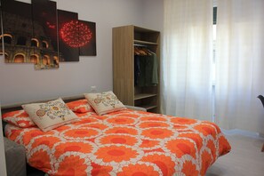 1 bedroom, desk, iron/ironing board, travel crib