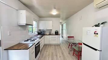 Microwave, stovetop, coffee/tea maker, cookware/dishes/utensils