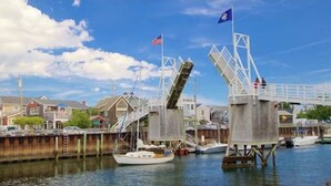 A waterfront area with a bridge, boats, and a dock. - Cozy 2 BR house in gated community 1 mile from Wells/Ogunquit beaches/shops  (Wells)