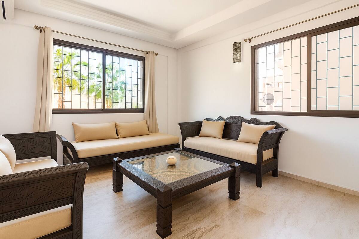 A living room with a sofa, a chair, and a coffee table.