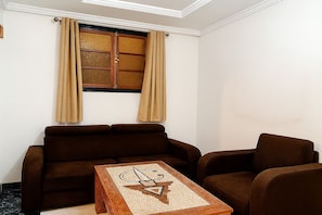 Premium Apartment, 3 Bedrooms | Living area | 55-cm Smart TV with satellite channels, Netflix, streaming services
