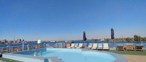 Outdoor pool, pool umbrellas, sun loungers